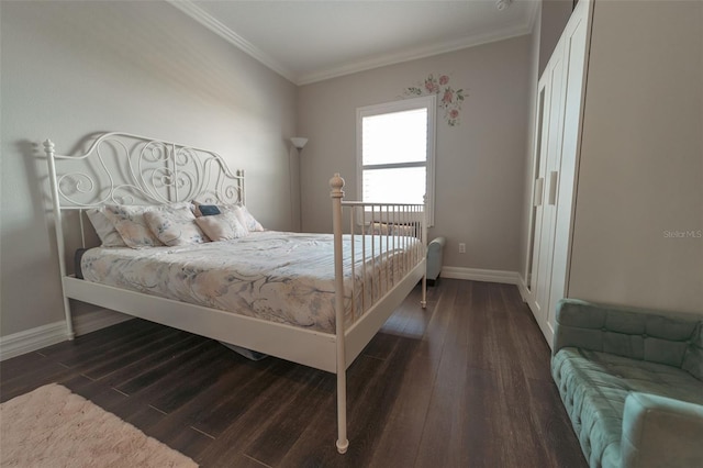 bedroom featuring crown molding and dark hardwood / wood-style floors