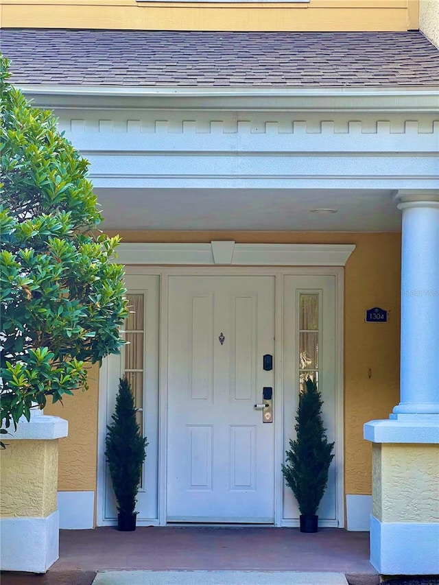 doorway to property with a porch