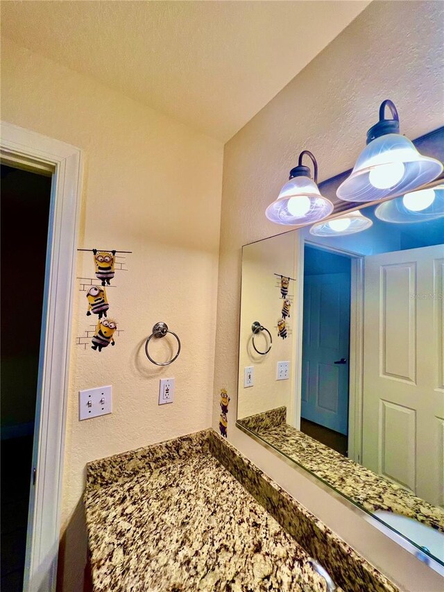 bathroom featuring a textured ceiling