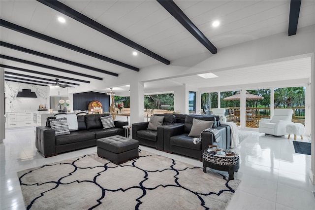 tiled living room with beam ceiling and ceiling fan