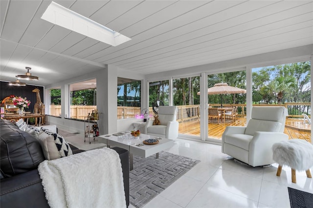 sunroom with a skylight and plenty of natural light