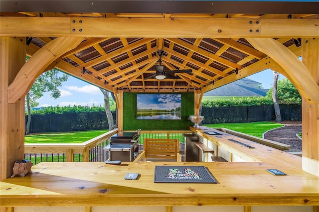 view of patio / terrace featuring a gazebo, ceiling fan, and a mountain view