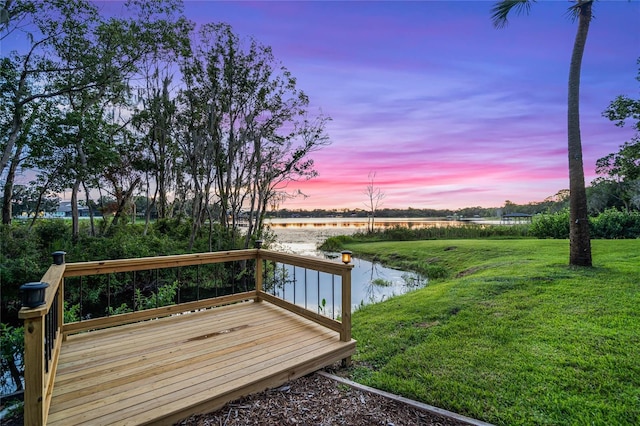 exterior space with a yard and a water view