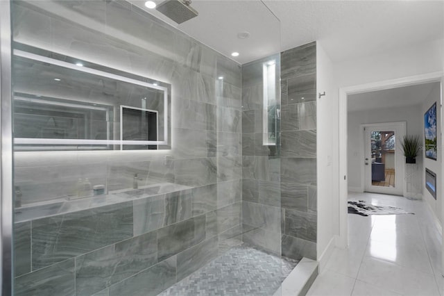 bathroom with tile patterned flooring and a shower