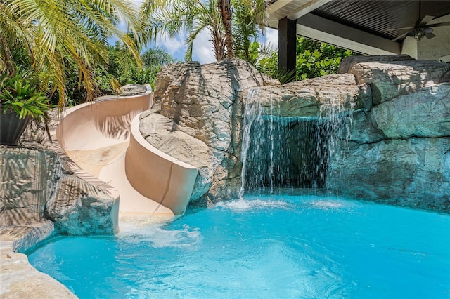 view of swimming pool featuring pool water feature