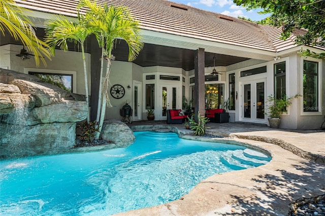 view of pool featuring ceiling fan, a patio, and french doors