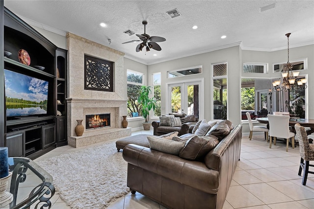 living room featuring light tile patterned floors, a textured ceiling, and a premium fireplace