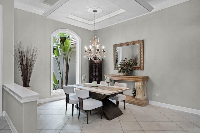 dining space with a raised ceiling, light tile patterned floors, crown molding, and a chandelier