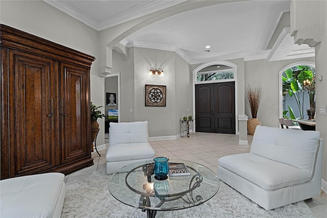 sitting room featuring a wealth of natural light, light tile patterned flooring, and ornamental molding