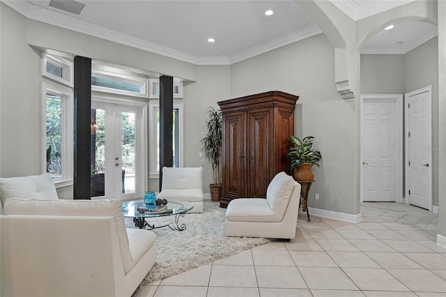 living area with light tile patterned floors, french doors, and ornamental molding