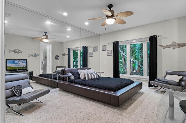 bedroom featuring ceiling fan and light colored carpet