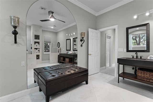 interior space featuring vanity, tile patterned floors, ceiling fan, and crown molding