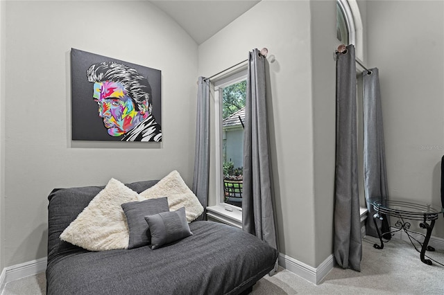 bedroom with light carpet and vaulted ceiling