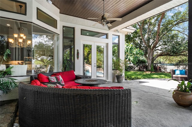 view of patio / terrace with ceiling fan, french doors, and an outdoor living space