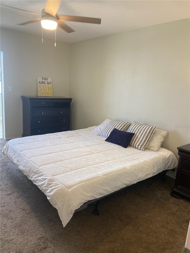 bedroom with ceiling fan and carpet floors