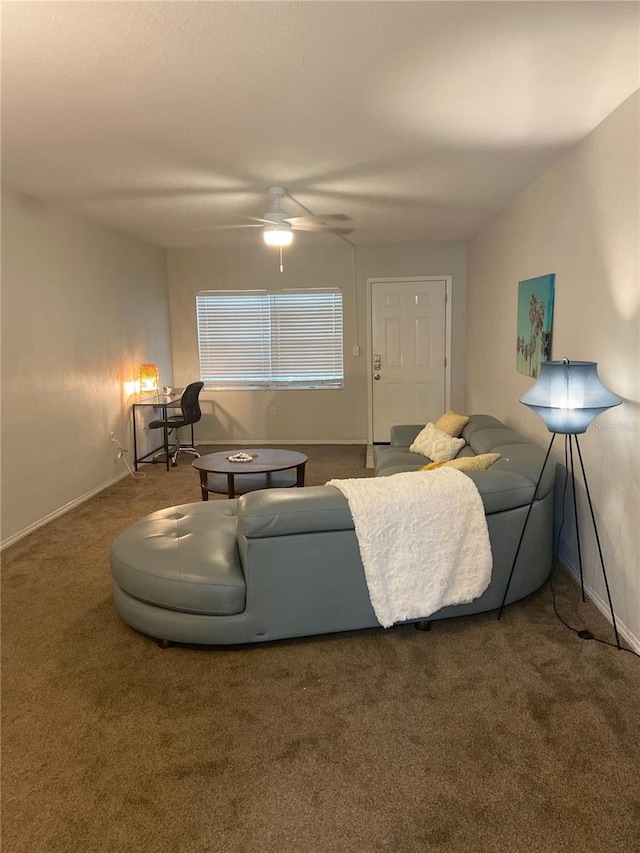 living room featuring ceiling fan and carpet floors