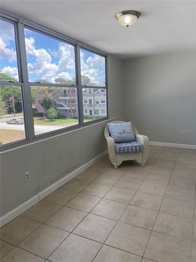 unfurnished room featuring light tile patterned floors