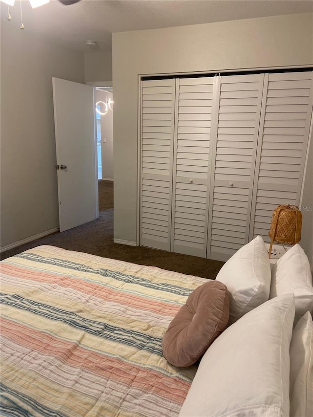 carpeted bedroom featuring a closet