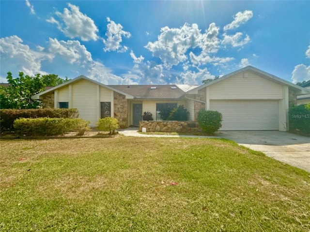 single story home with a garage and a front lawn