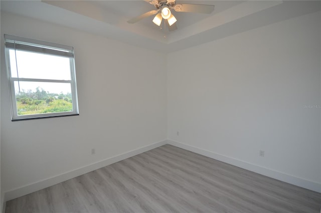 unfurnished room featuring hardwood / wood-style floors and ceiling fan