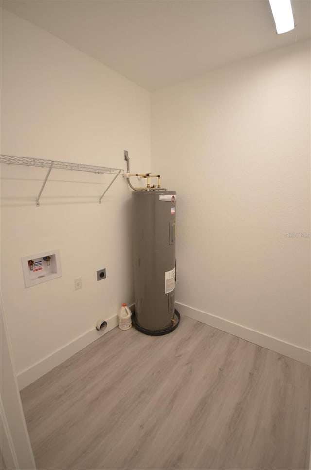 laundry area with hookup for an electric dryer, light wood-type flooring, electric water heater, washer hookup, and laundry area