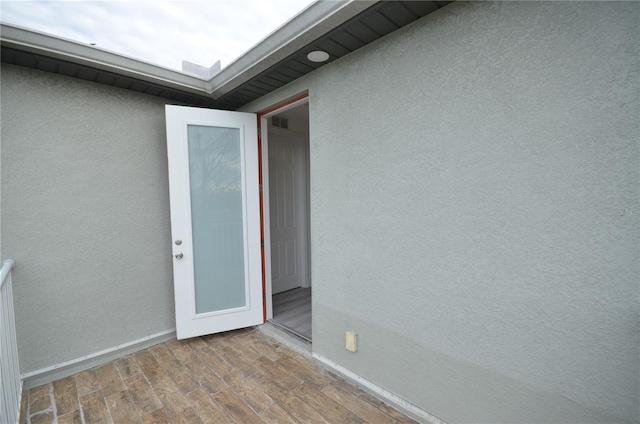 property entrance featuring stucco siding