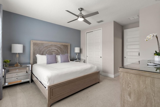 carpeted bedroom with a closet and ceiling fan