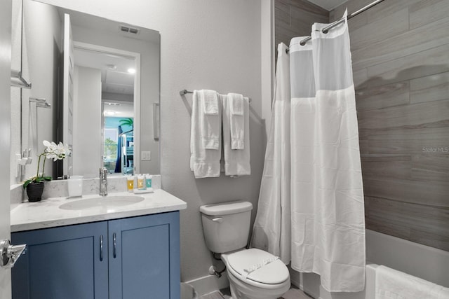 full bathroom with vanity, shower / bathtub combination with curtain, and toilet