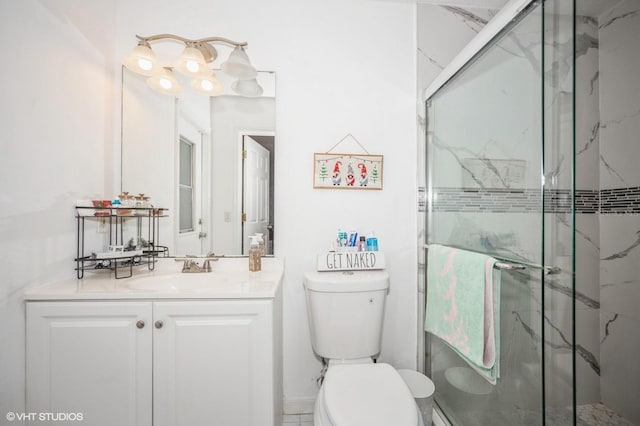 bathroom with vanity, toilet, and an enclosed shower