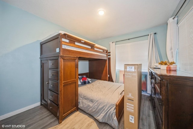 bedroom with hardwood / wood-style flooring