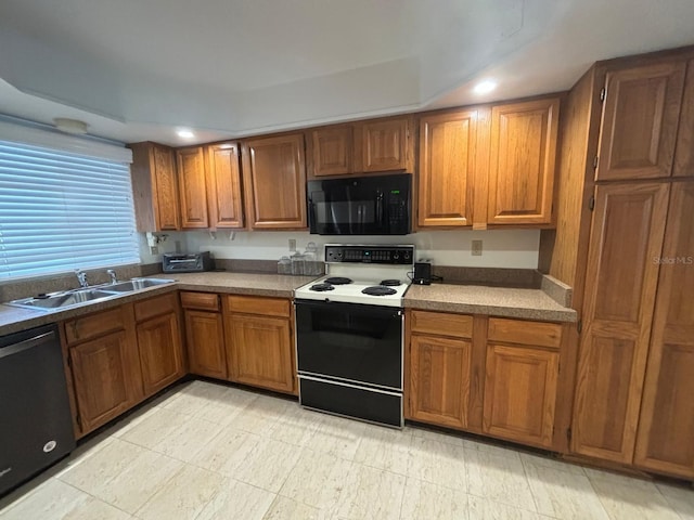 kitchen with sink and black appliances