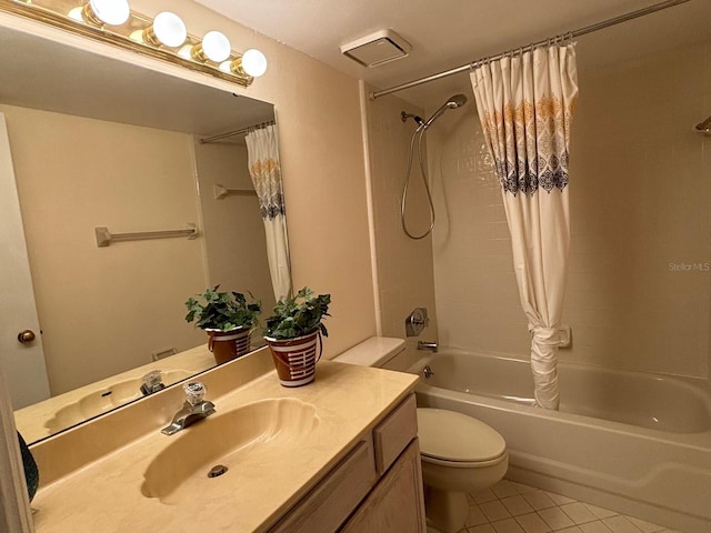 full bathroom with tile patterned flooring, vanity, toilet, and shower / bath combo with shower curtain