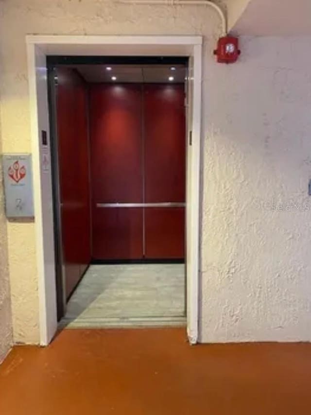 corridor featuring elevator