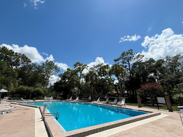 view of swimming pool with a patio area