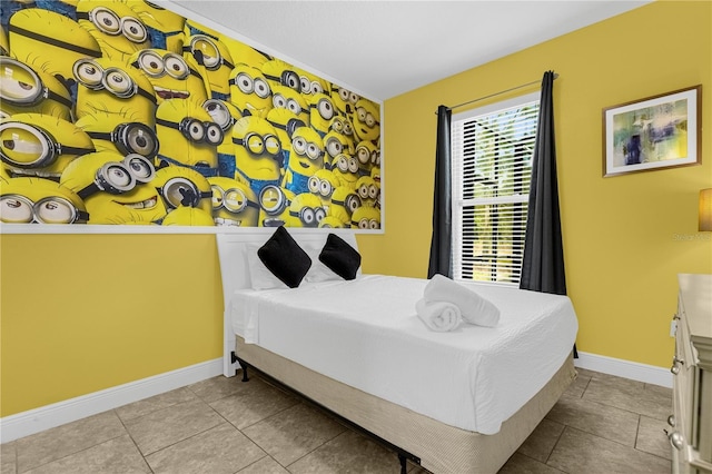 bedroom with light tile patterned floors