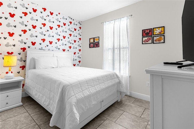 bedroom with light tile patterned flooring