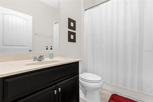 bathroom featuring vanity, tile patterned flooring, a shower with curtain, and toilet