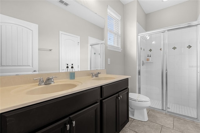 bathroom with walk in shower, vanity, toilet, and tile patterned flooring