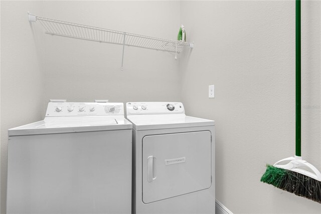 laundry area featuring washing machine and dryer