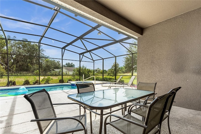 view of pool with an in ground hot tub, a lanai, and a patio