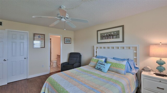 bedroom with ensuite bathroom, a textured ceiling, ceiling fan, dark hardwood / wood-style floors, and a closet