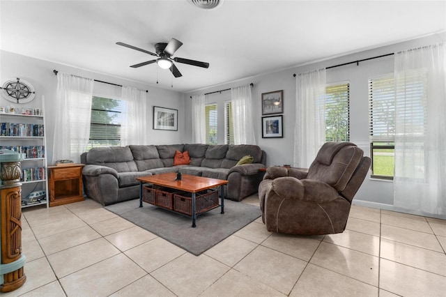 tiled living room featuring ceiling fan