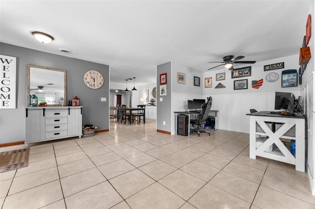 tiled office space with ceiling fan