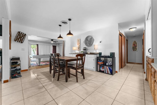 dining space featuring light tile patterned floors, ceiling fan, and pool table