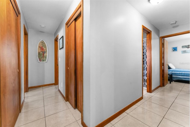 hallway with light tile patterned flooring