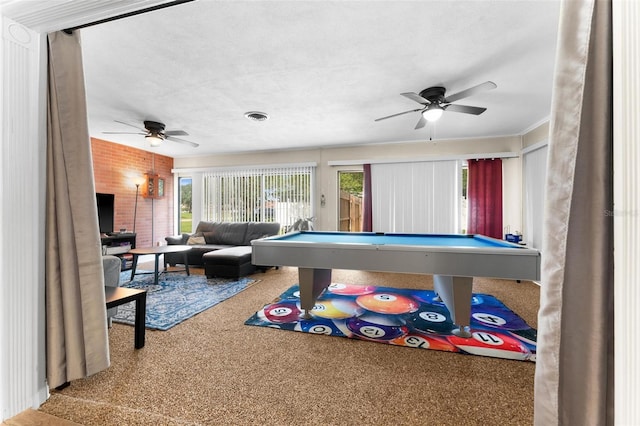 playroom featuring carpet, ceiling fan, a textured ceiling, and billiards