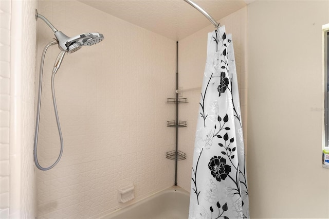 bathroom featuring shower / bath combo with shower curtain