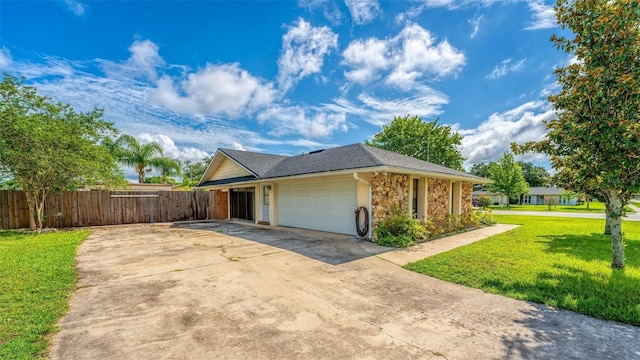 ranch-style home with a garage and a front yard