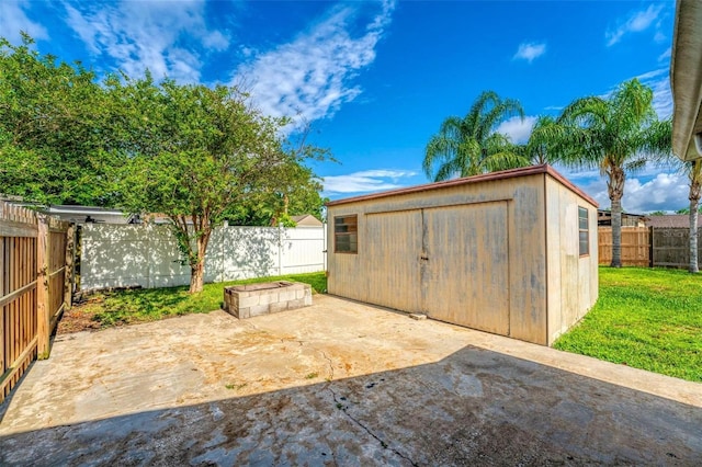 view of outbuilding with a lawn