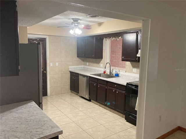 kitchen featuring stainless steel dishwasher, ceiling fan, sink, light tile patterned floors, and black electric range oven